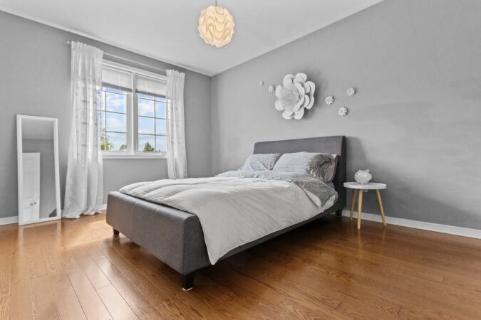Interior real estate photography example by Show Kingston – bright master bedroom in Kingston, Ontario