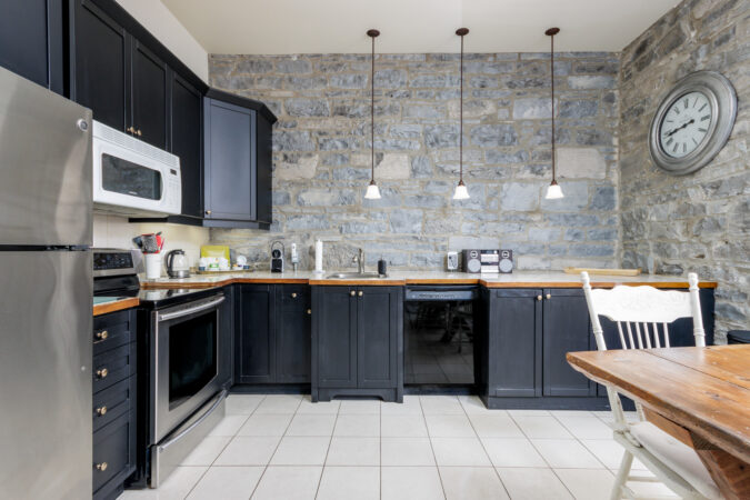 Interior real estate photography example by Show Kingston – large kitchen in old Inn near Kingston, Ontario
